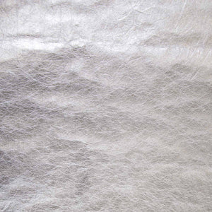 Close-up of textured metallic silver fabric